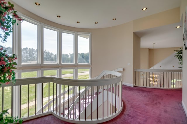 carpeted bedroom featuring multiple windows