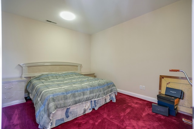 bedroom featuring dark carpet