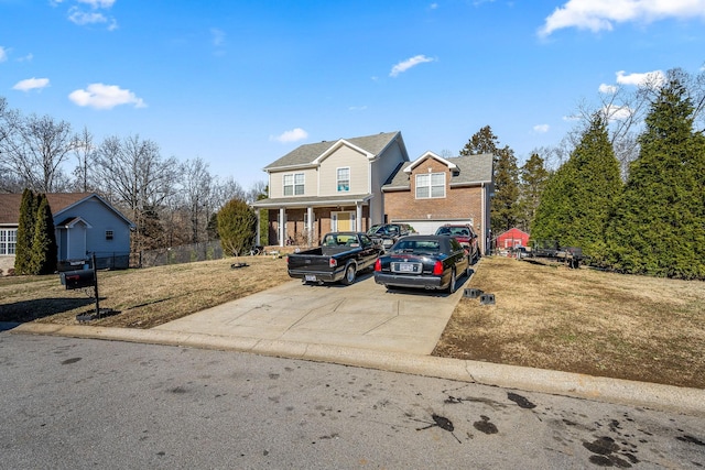 front of property featuring covered porch and a front yard