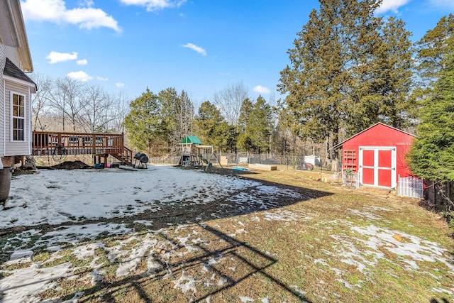 view of yard with a playground and a shed