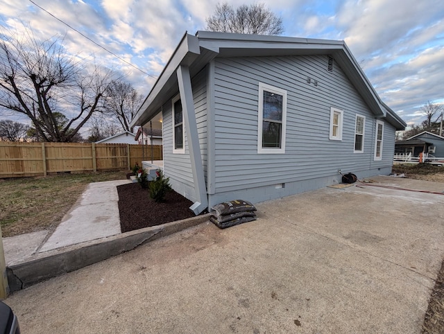 view of side of property with a patio