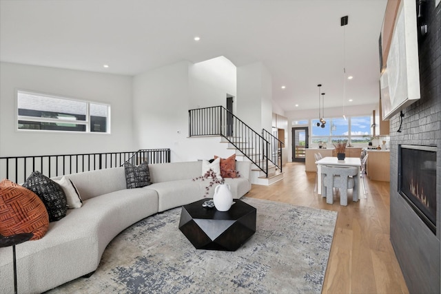 living room featuring light hardwood / wood-style floors and a fireplace