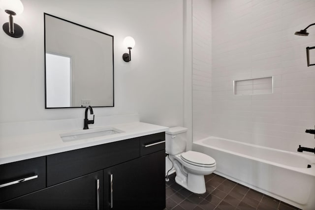 full bathroom with tiled shower / bath combo, vanity, and toilet