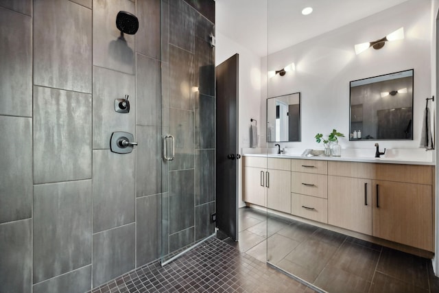 bathroom with vanity, tile patterned flooring, and a shower with shower door