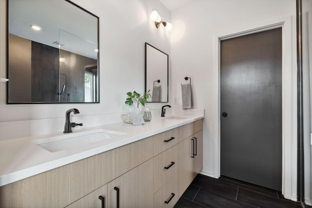 bathroom with a shower and vanity