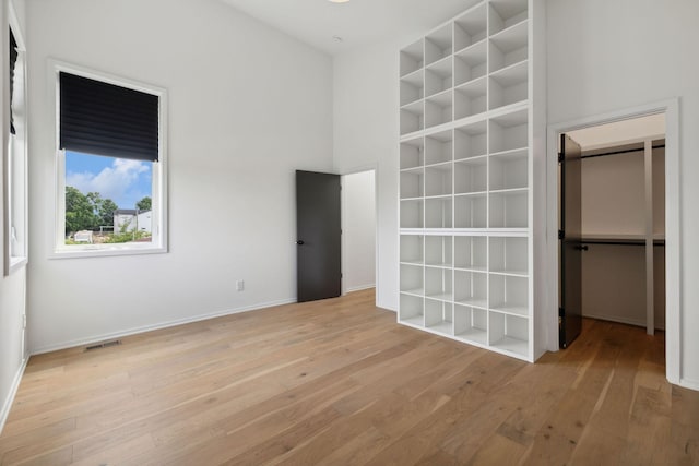 unfurnished bedroom featuring light wood-type flooring