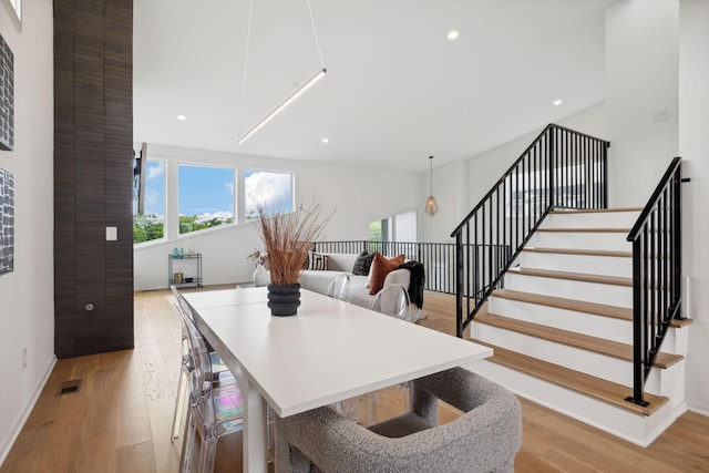 dining area with light hardwood / wood-style floors