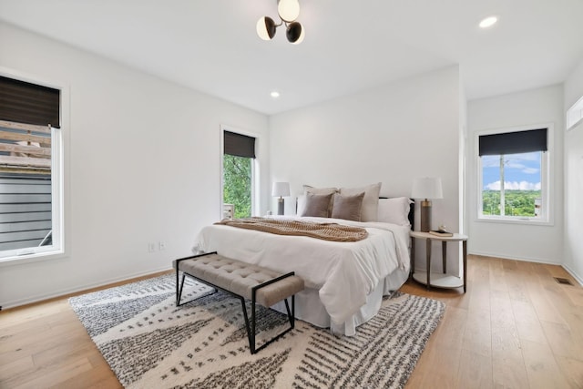 bedroom with light hardwood / wood-style floors