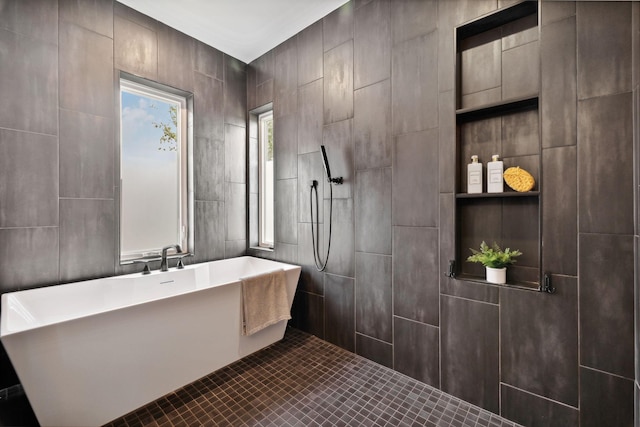 bathroom with tile patterned floors and independent shower and bath