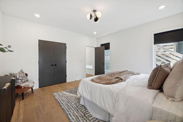 bedroom featuring a closet and light hardwood / wood-style flooring