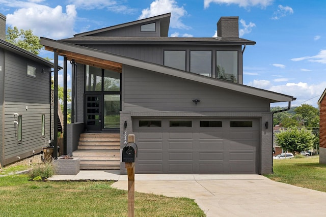 modern home with a front lawn