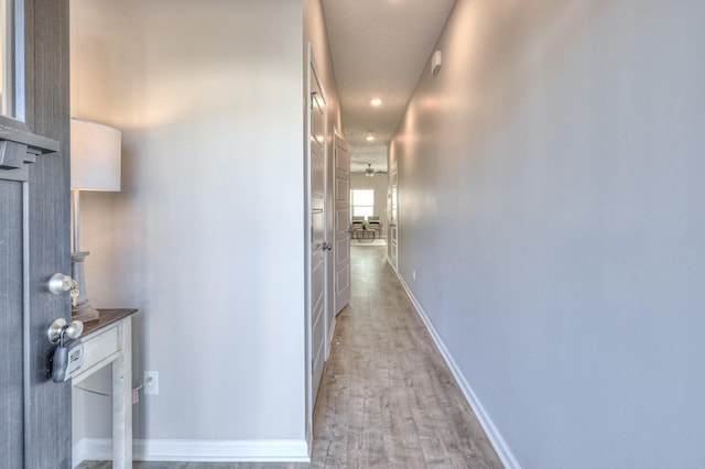 corridor featuring light hardwood / wood-style floors