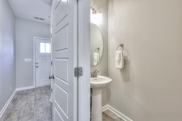 bathroom featuring hardwood / wood-style flooring and sink