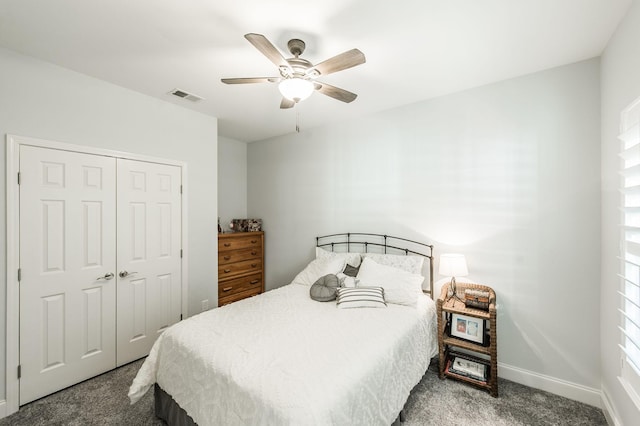 carpeted bedroom with ceiling fan and a closet