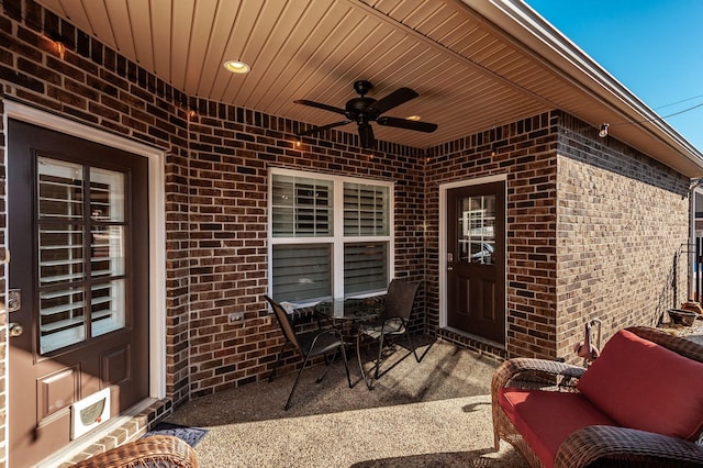 view of patio featuring ceiling fan