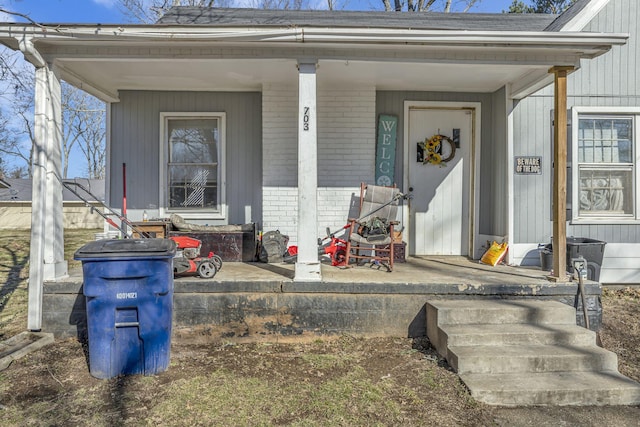 doorway to property with covered porch