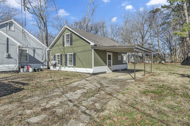 rear view of property featuring a carport