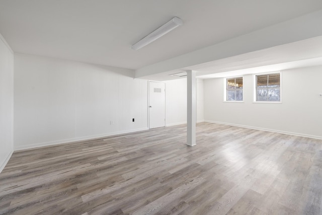 basement featuring hardwood / wood-style flooring