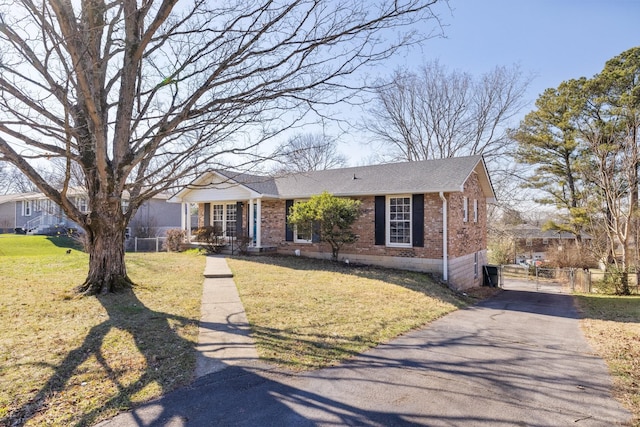 view of front of property with a front yard and covered porch