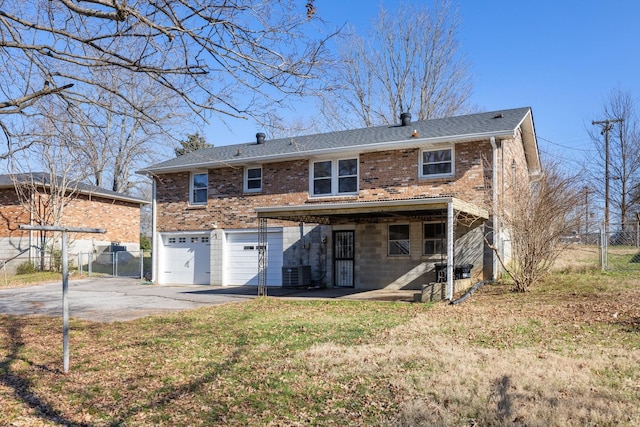 back of house featuring central AC and a garage