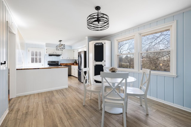 dining area featuring light wood-type flooring