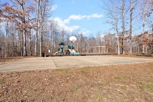 view of sport court with a playground