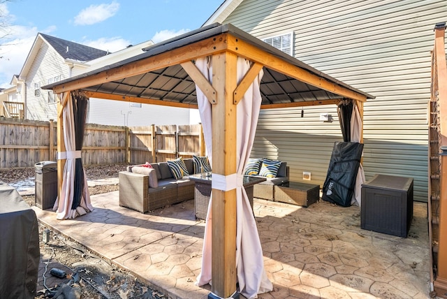 view of patio featuring an outdoor hangout area and a gazebo