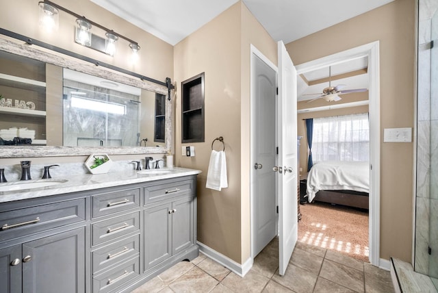 bathroom featuring tile patterned flooring, ceiling fan, and vanity