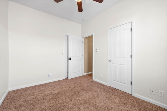 unfurnished bedroom featuring ceiling fan and carpet floors