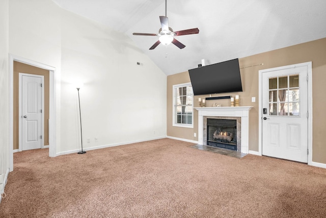 unfurnished living room with high vaulted ceiling, a fireplace, ceiling fan, and carpet floors