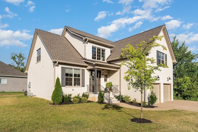 view of front of house with a front lawn and a garage