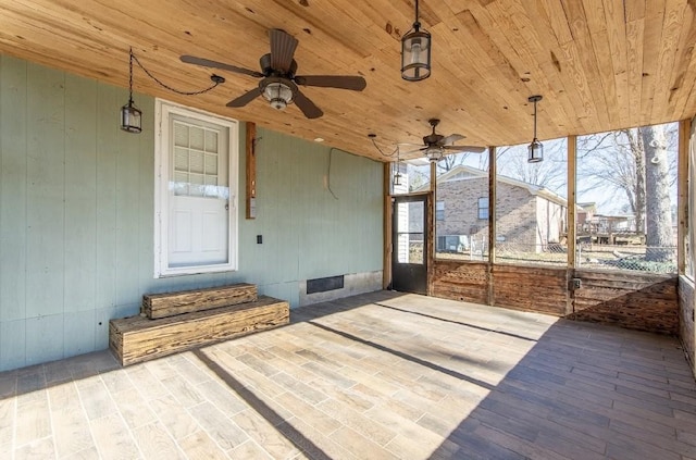 exterior space with wood ceiling and ceiling fan