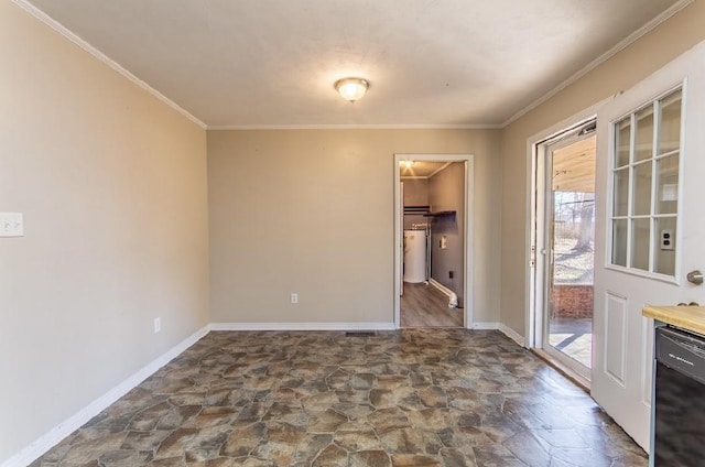 unfurnished room featuring ornamental molding, stone finish floor, and baseboards