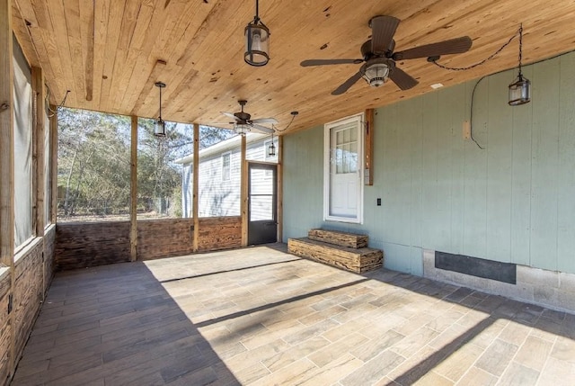 unfurnished sunroom with wooden ceiling