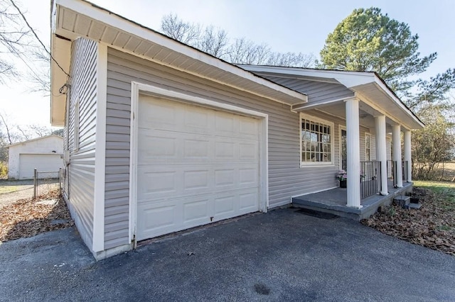 exterior space featuring driveway and a porch