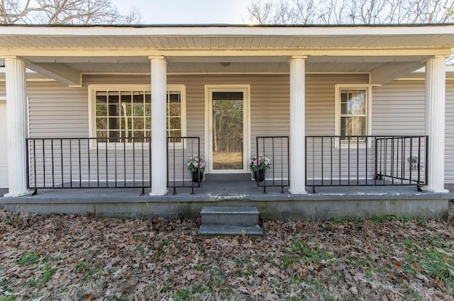 doorway to property featuring a porch