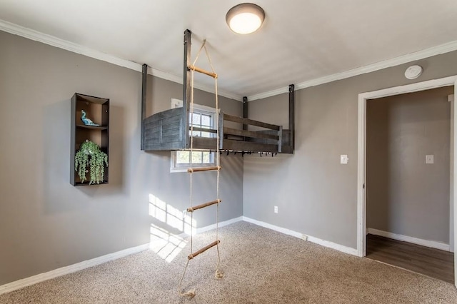 interior space with crown molding, carpet floors, and baseboards