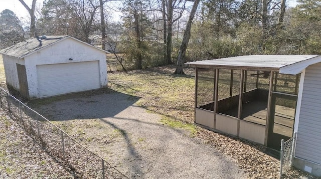 view of yard with a garage and an outdoor structure