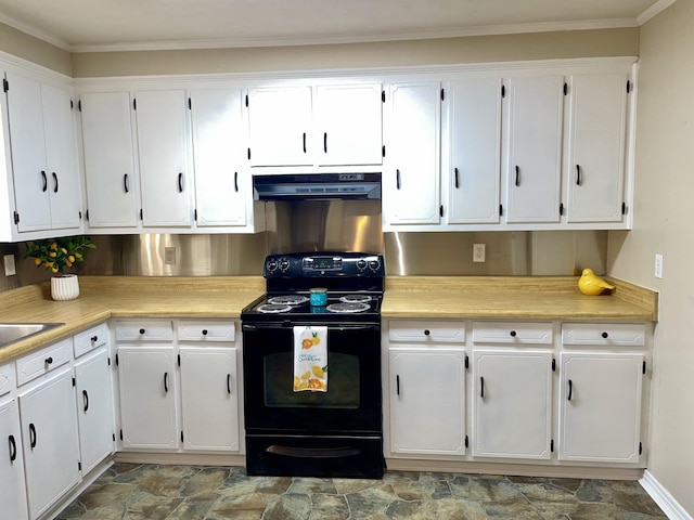 kitchen with black electric range, light countertops, stone finish flooring, white cabinets, and under cabinet range hood