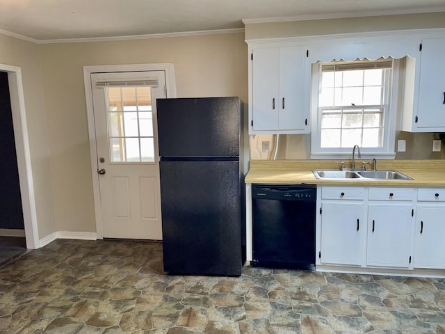 kitchen with black appliances, a sink, light countertops, and white cabinets