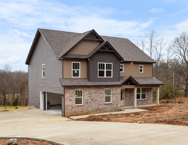 view of front of home with covered porch and a garage