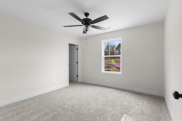 carpeted empty room with ceiling fan