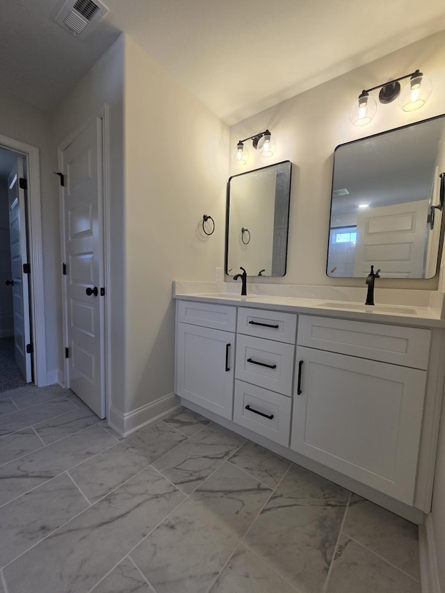 full bathroom with visible vents, baseboards, a sink, double vanity, and marble finish floor