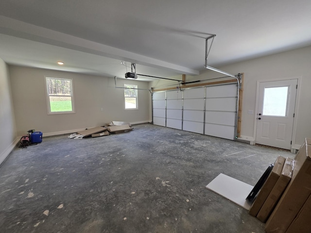garage featuring baseboards and a garage door opener