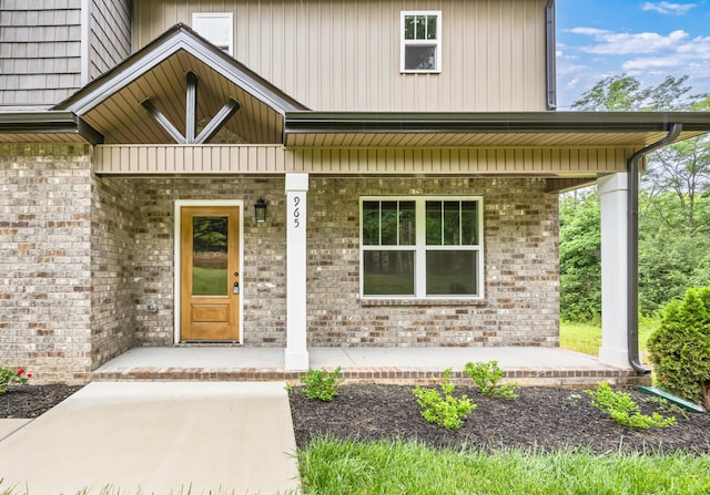 965 Palmyra Rd, Clarksville, TN 37040 - view of exterior entry featuring covered porch and brick siding