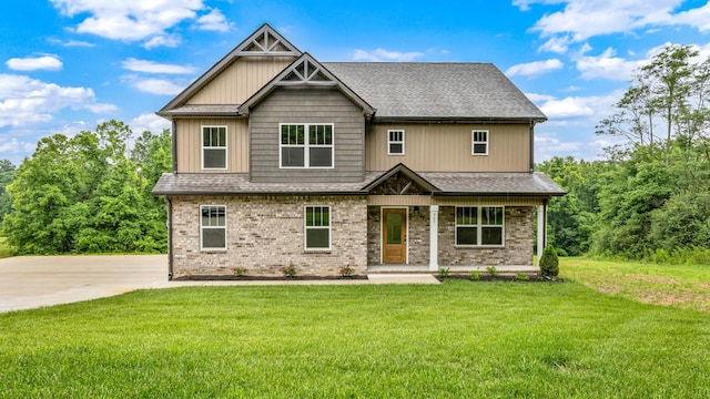 965 Palmyra Rd, Clarksville, TN 37040 - craftsman inspired home with a front lawn, covered porch, brick siding, and a shingled roof