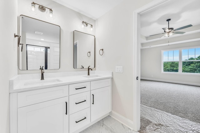 965 Palmyra Rd, Clarksville, TN 37040 - bathroom featuring double vanity, baseboards, a ceiling fan, and marble finish flooring