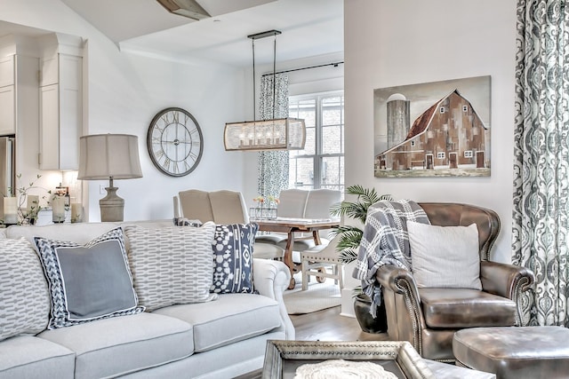 living room featuring hardwood / wood-style flooring and a notable chandelier