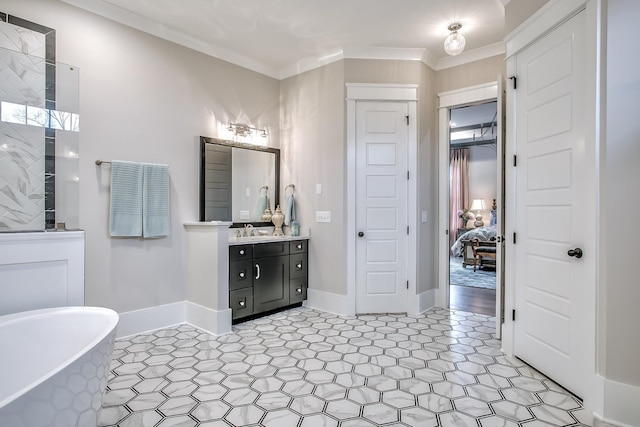 bathroom featuring vanity, crown molding, and a bath