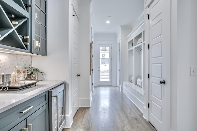 interior space with light wood-type flooring and wine cooler